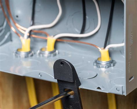 remove knockout from plastic electrical box|open knockouts in electrical panels.